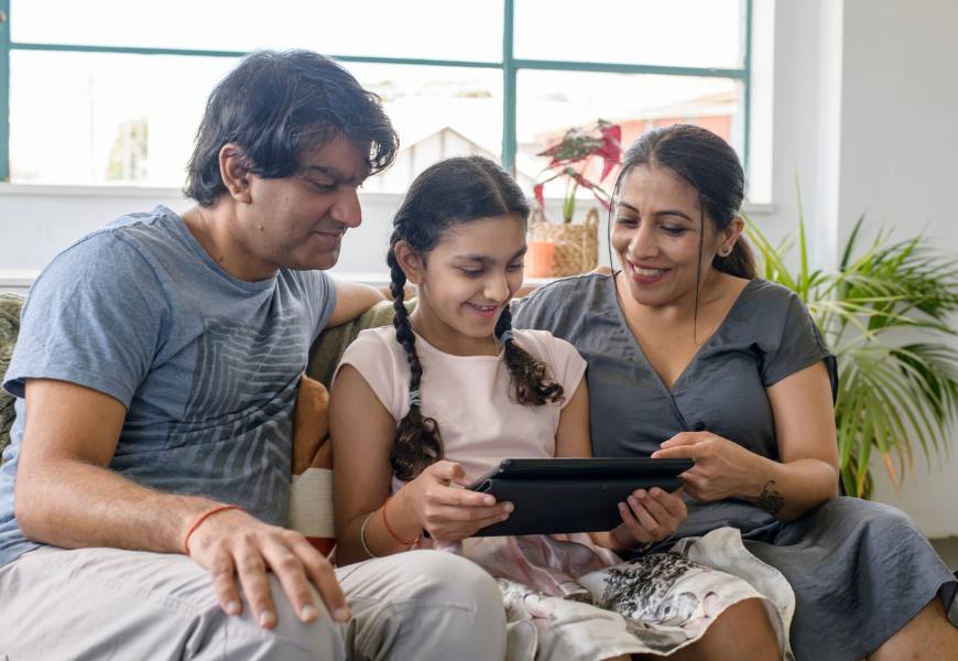 family-using-tablet-device-together